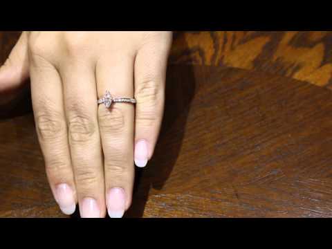 Marquise Engagement Ring WITH A DIAMOND BAND IN WHITE GOLD ON A WOMANS HAND