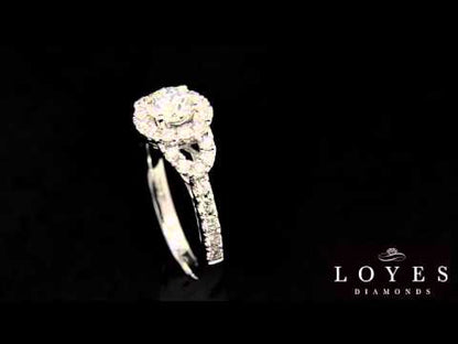 Triple Halo Engagement Ring  in white gold revolving in front of a black background