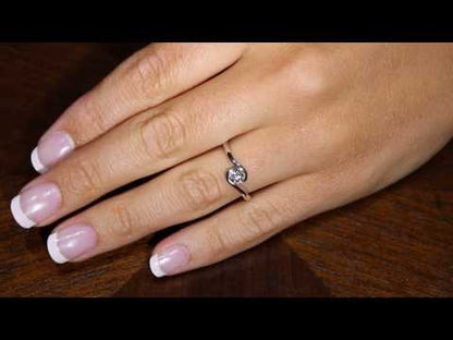 Tension Set Diamond Ring with matching wedding ring in white gold on a hand