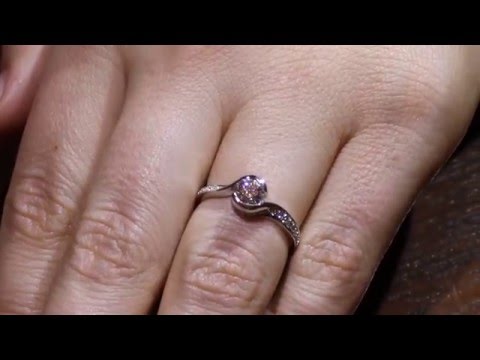 Halo Twist Engagement Ring IN WHITE GOLD ON A GIRLS FINGER