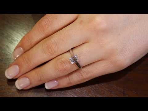 Emerald cut solitaire engagement ring IN white Gold on a lady&