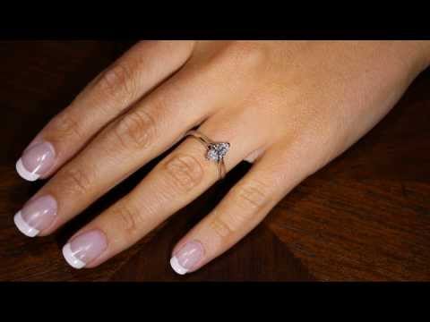 Marquise Solitaire Engagement Ring set in white gold on a lady&