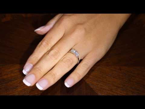 a video of a Princess and Round Three Stone on a lady&