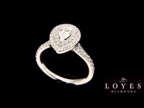 Double Halo Pear Diamond Ring in white gold rotating against a black background