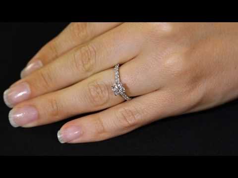 Solitaire With Diamond Shoulders ENGAGEMENT RING IN WHITE GOLD ON A WOMAN&