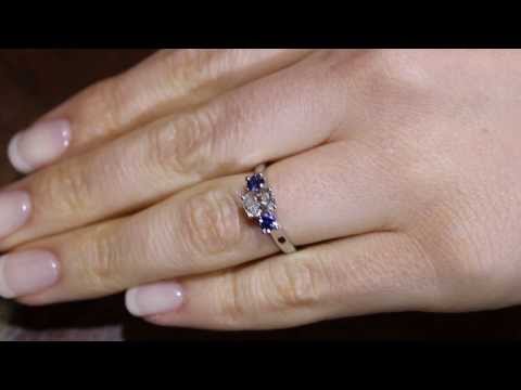 Diamond Sapphire Trilogy set in white gold on a ladys finger
