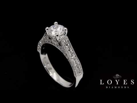 Diamond Encrusted Engagement Ring IN WHITE GOLD WITH A BLACK BACKGROUND