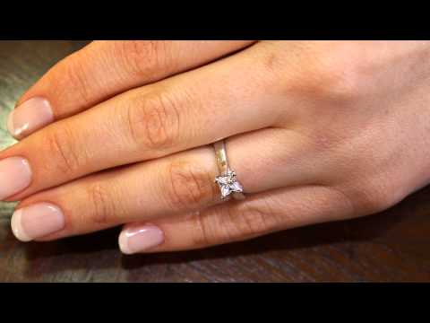 Princess cut engagement ring in platinum on a ladies finger